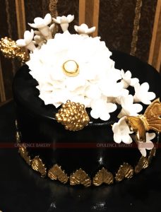 elegant white golden black cake