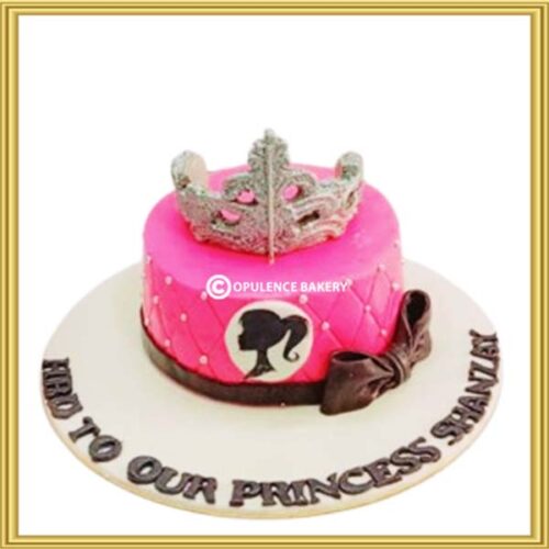 Custom hot pink Barbie theme princess cake in Lahore with silver tiara topper by Opulence Bakery.