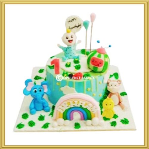Custom 3D Cocomelon themed 1st birthday cake in Lahore featuring JJ and animal figures by Opulence Bakery.