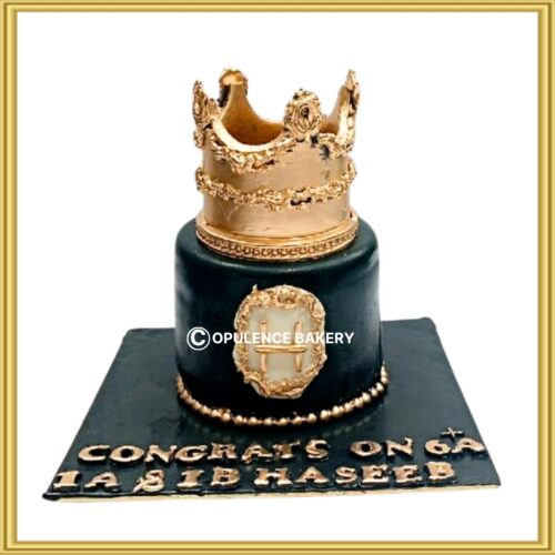 Customized black and gold royal crown theme cake in Lahore by Opulence Bakery.
