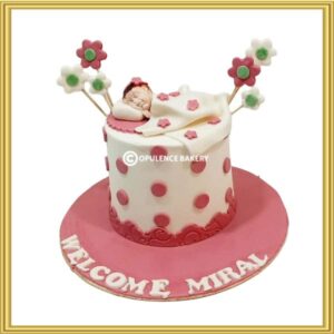 Sleeping baby theme pink and white welcome baby girl cake in Lahore by Opulence Bakery.