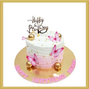 Designer pink butterfly birthday cake with gold spheres in Lahore by Opulence Bakery.