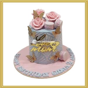 Customized mother's birthday cake with pink roses and gold butterflies in Lahore by Opulence Bakery.