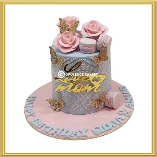 Customized mother's birthday cake with pink roses and gold butterflies in Lahore by Opulence Bakery.