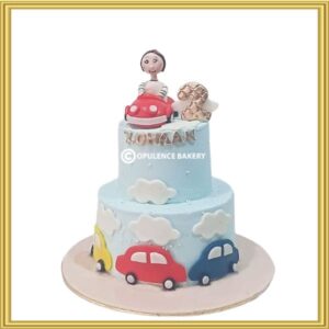 Designer 2 tier sky blue car theme birthday cake in Lahore with 3D red car topper by Opulence Bakery.