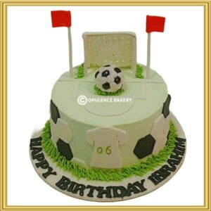 Custom soccer pitch football birthday cake in Lahore with 3D football and goal net topper by Opulence Bakery.