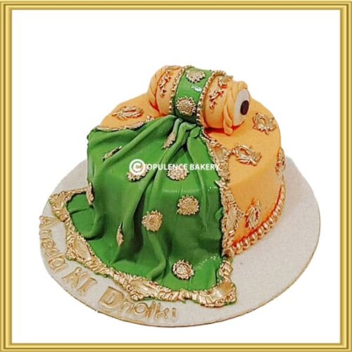 Customized dholki theme wedding cake with 3D dholak topper in Lahore by Opulence Bakery.