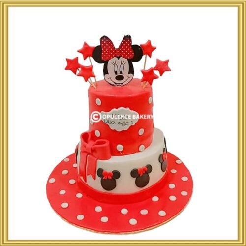 Custom 2 tier Minnie Mouse 1st birthday cake with red polka dots and star toppers in Lahore