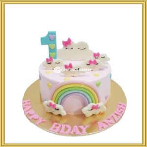 Custom pastel rainbow and sleeping cloud 1st birthday cake in Lahore by Opulence Bakery.