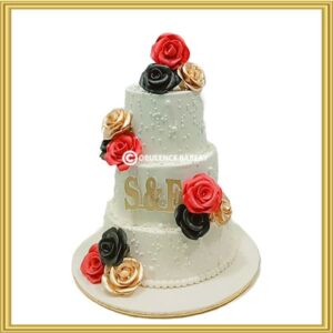 3-tier wedding cake with red, black, and gold roses in Lahore by Opulence Bakery.