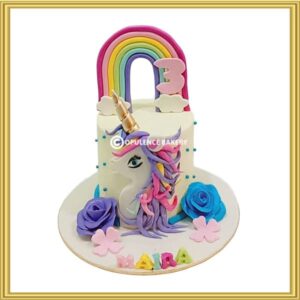 Custom magical unicorn birthday cake with gold horn and pink piping mane in Lahore