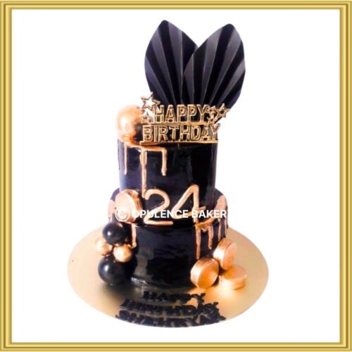Luxury black and gold drip birthday cake in Lahore with metallic spheres and fan toppers