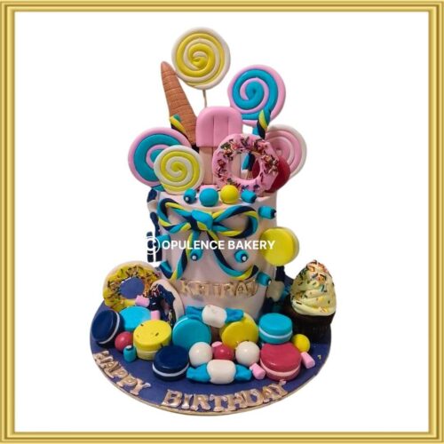 Candyland sweets birthday cake in Lahore with lollipops, donuts, ice cream, and macarons